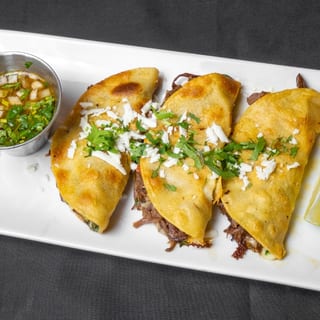 Birria Tacos On Flour Tortillas